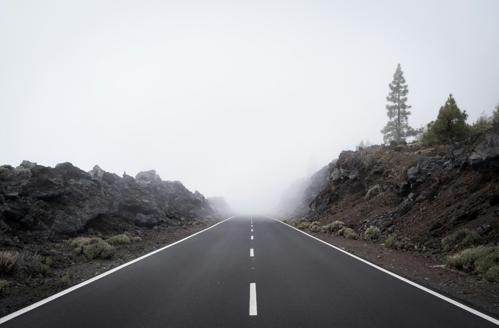 gray roads between mountains